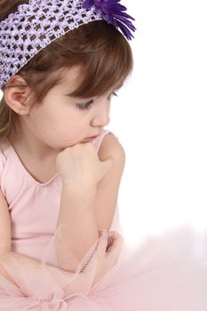 Serious brunette girl wearing a ballet tutu