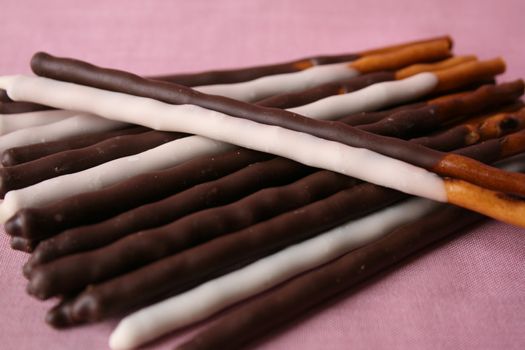 Chocolate and Yogurt covered sticks on a pink background
Chocolate Sticks in a frosted glass
