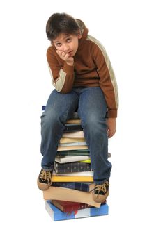 Boy sitting on a big pile of books. Different expressions (series)
