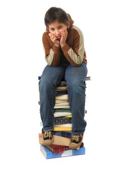 Boy sitting on a big pile of books. Different expressions (series)  