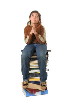 Boy sitting on a big pile of books. Different expressions (series)  