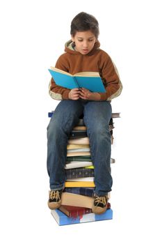 Boy sitting on a big pile of books. Different expressions (series)  