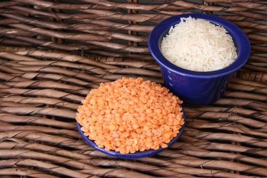 Rice and lentils in blue ceramic bowls
