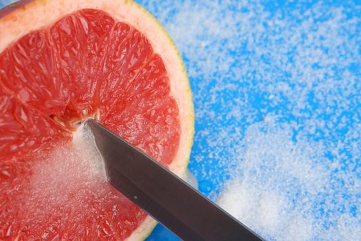 Half Sliced Pomelo on a bright background