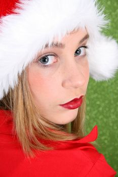 Teenager with red lips wearing a christmas hat