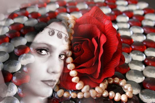 Female model withwearing folk dress layered with pebbles and jewelery