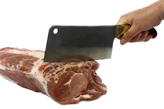 Hand chopping a raw pork roast - isolated over white background