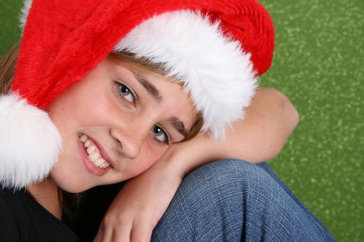 Beautiful teenager girl wearing a christmas hat