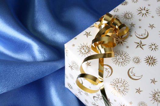 Wrapped Christmas present with a golden ribbon