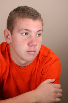 Teenage male in casual attire looking into the distance