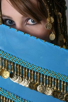 Beautiful young teenager posing in a belly dance costume