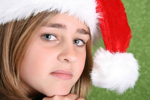 Beautiful teenager girl wearing a christmas hat