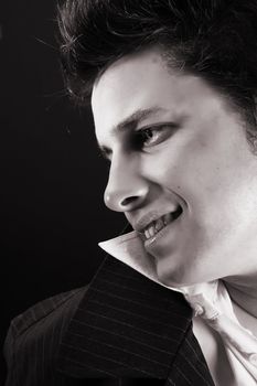 Male model in studio against black background