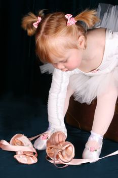 Little ballet toddler wearing a white tutu
