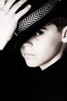 Teenage boy wearing a black hat in casual wear
