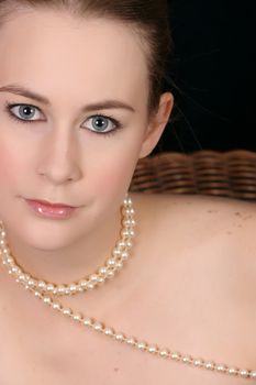 Close up of beautiful female wearing pearls 