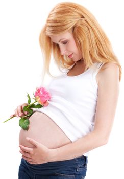Pregnant woman standing on isolated white with rose petals