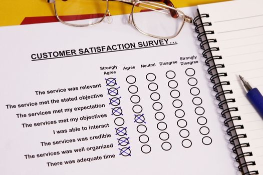 A survey sitting with a pen agree on  excellent customer service.
