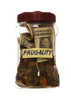 Frugality concept- jar close full of coins and dollar. Isolated in white background.