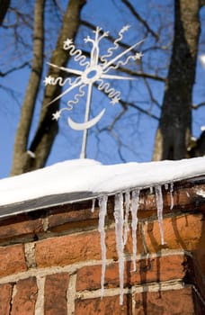 winter icicle on red brick wall