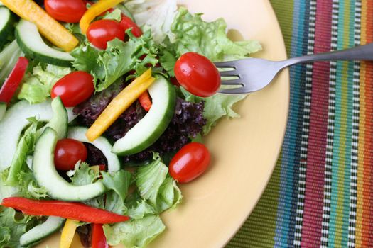 Fresh colorful salad with cherrie tamatoes and cucumber