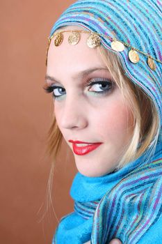 Female model with blue eyes wearing traditional folk dress