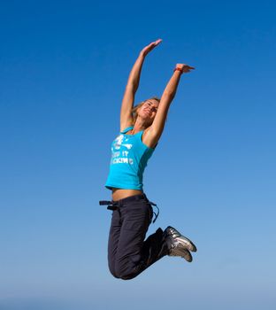 jumping girl blue sky high