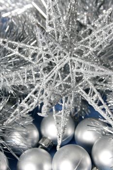 Silver Christmas star decoration, balls and tinsel