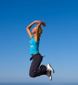 jumping girl blue sky high