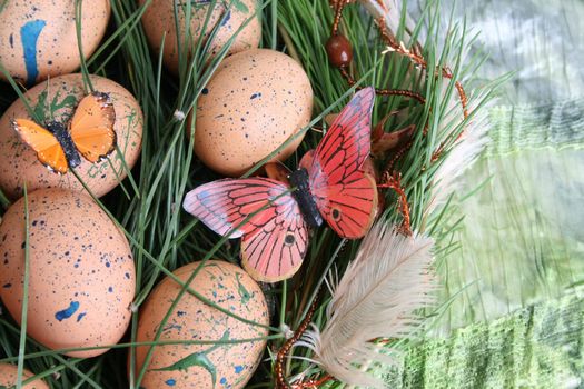 Decorated eggs in a wreath on a green background
