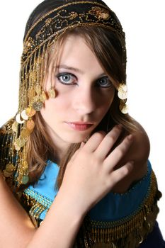 Beautiful young teenager posing in a belly dance costume