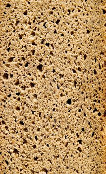 ecological brown bread slice background and texture