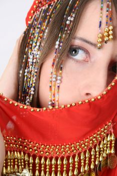 Beautiful young teenager posing in a belly dance costume
