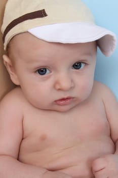 Ten week old baby boy wearing a hat