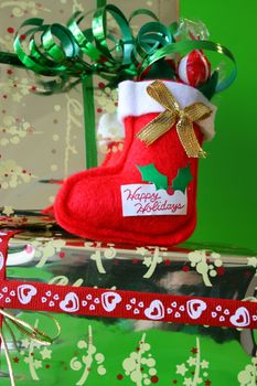 Miniature Christmas Stocking on a gold wrapped gift
