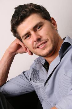 Male model in studio against white wall