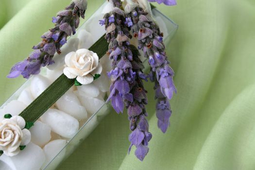 White bath crystals in a PVC box decorated with flowers