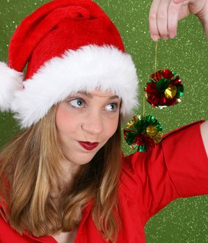 Teenager with red lips wearing a christmas hat