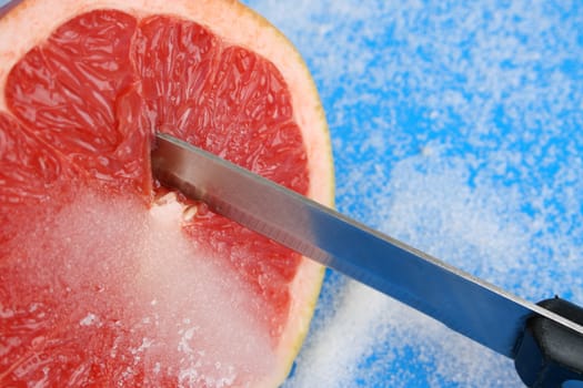 Half Sliced Pomelo on a bright background