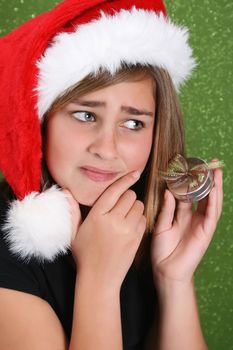 Beautiful teenager girl wearing a christmas hat