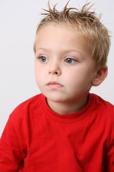 Beautiful blond toddler on a white background