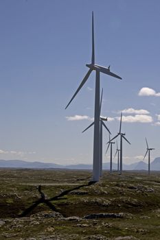 Wind turbines on Smøla, Norway With a total of 68 wind turbines, the Smøla Wind Farm is Europe’s largest land-based wind generating facility, producing an annual 450 GWh of electricity. The wind turbines are 70 m high. The rotors are 83 m in diameter, and each turbine weighs just over 260 tonnes.