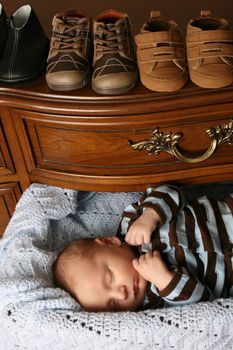 Month old baby boy sleeping in a drawer