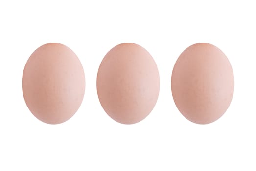 Three brown eggs, upright and lined up in a row, extracted and isolated against a white background.