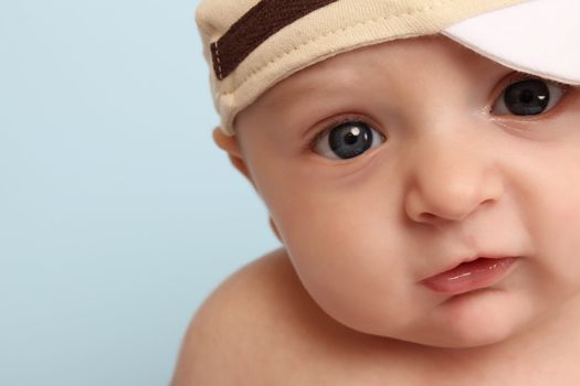Ten week old baby boy wearing a hat