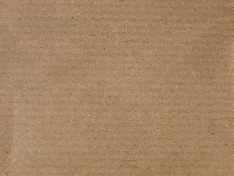 Brown corrugated cardboard sheet useful as a background