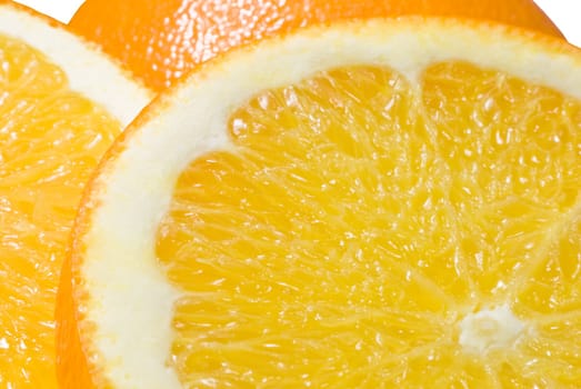 Close-up (macro) of two slices of orange and one upturned half-orange against a pure white background.  (Original background extracted).