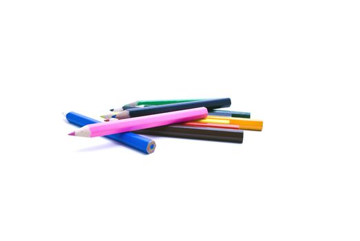 Coloured pencils scattered on a white surface with white background.  Pencil colours: pink; red; yellow; green; orange; ochre; light blue; brown; black; dark blue; green
