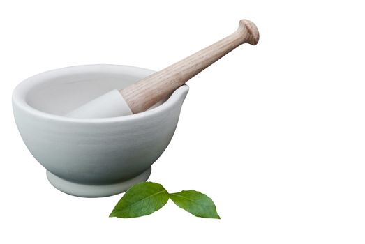 A pestle and mortar with bay leaves waiting to be crushed