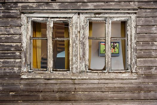 House needs maintenance while owner relax in front of the television